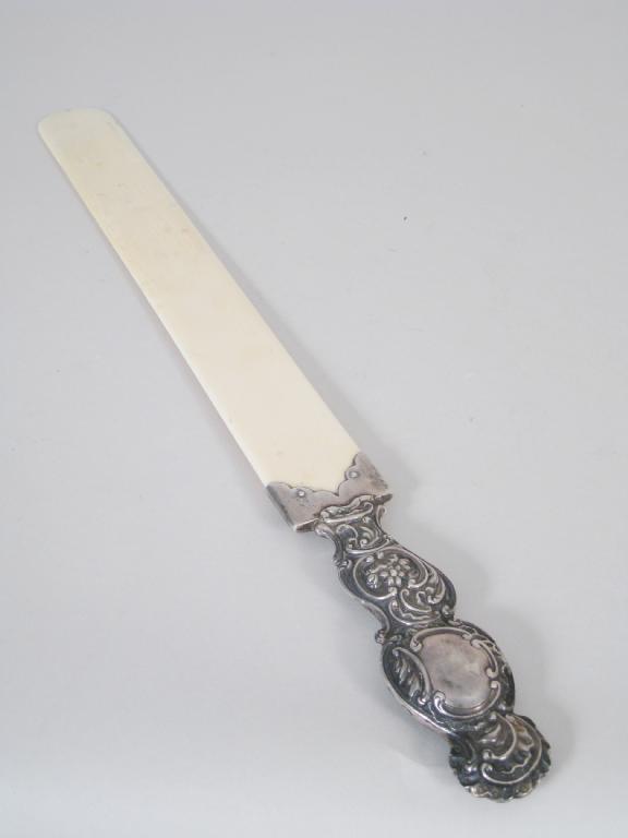 Appraisal: A Victorian silver handled ivory Page Turner with floral and