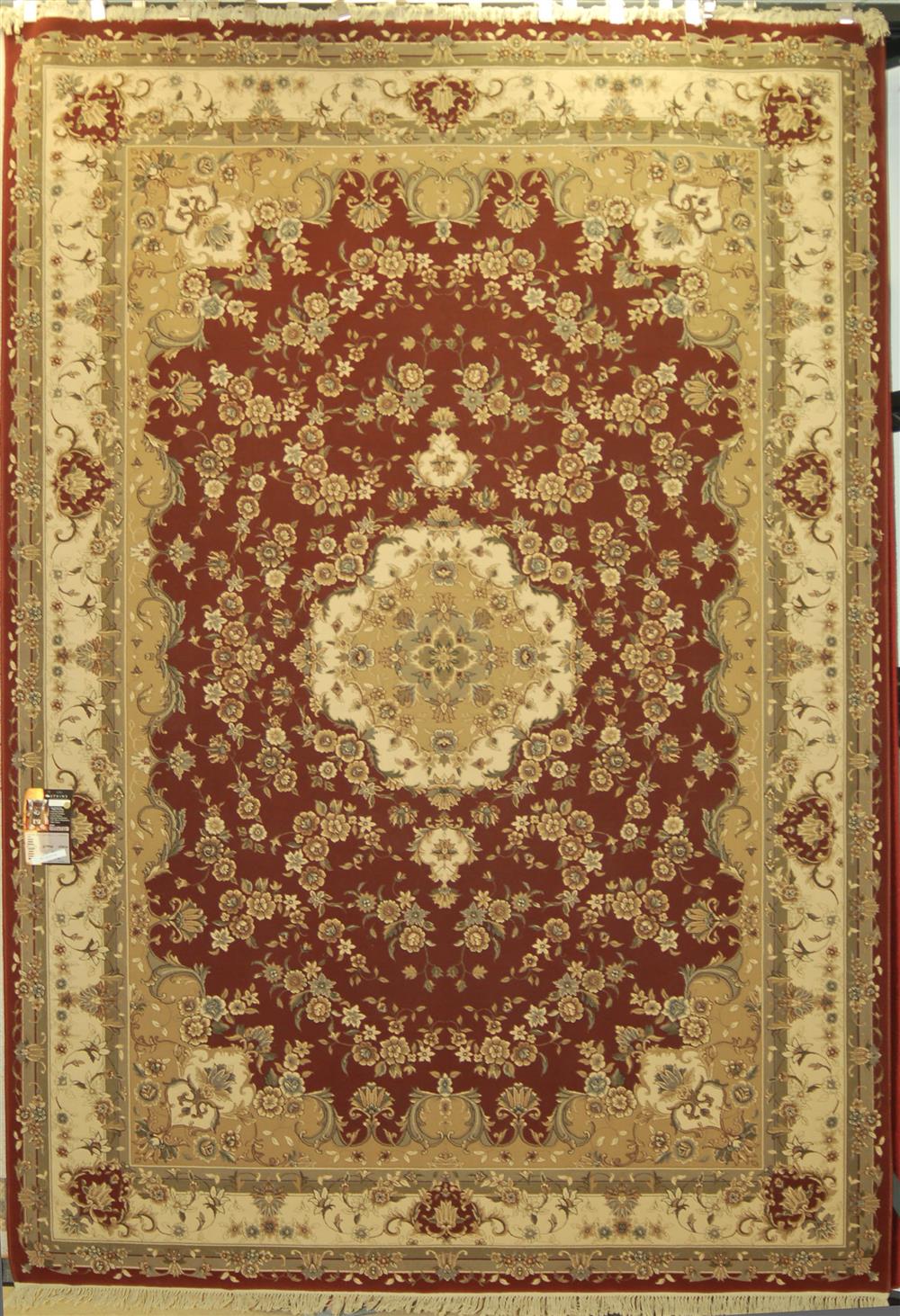 Appraisal: ORIENTAL MACHINE MADE SYNTHETIC RUG having a center medallion with