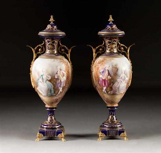 Appraisal: Pair of French Sevres style ormolu-mounted paint decorated parcel-gilt bleu