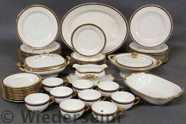 Appraisal: Partial Limoges dinner service with gilt and cobalt blue borders