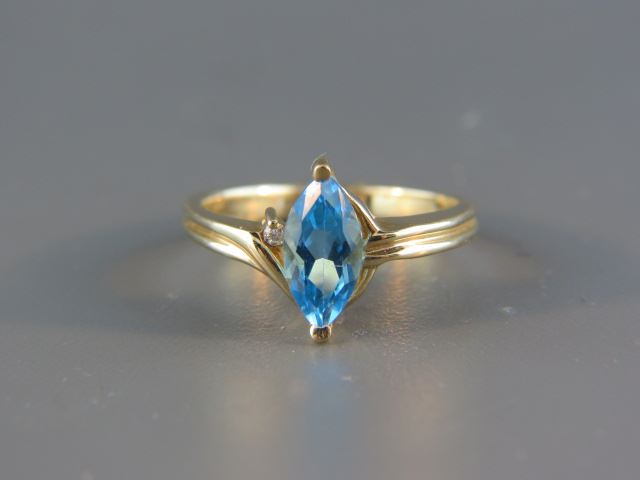 Appraisal: Blue Topaz and Diamond Ring rich marquise gem with diamond