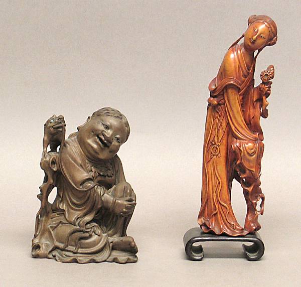 Appraisal: Two carved wood Daoist immortals The first a willowy female