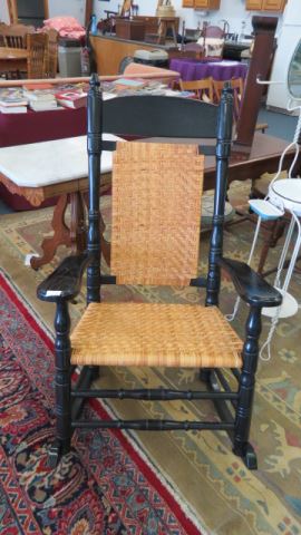 Appraisal: Brumby Rocker oak with black finish woven rattan seat famous