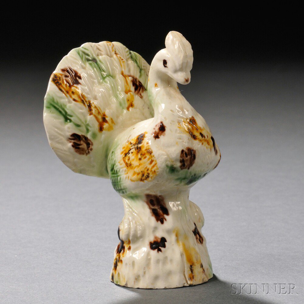 Appraisal: Staffordshire Cream-colored Earthenware Model of a Peacock England c decorated