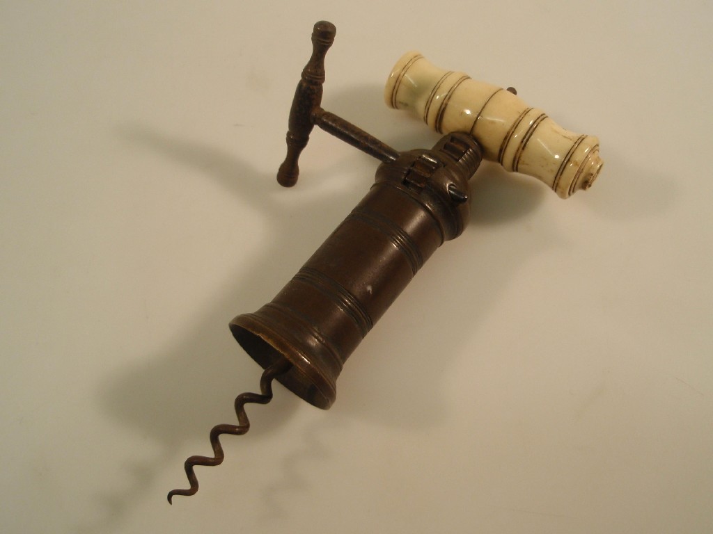 Appraisal: A thC patent brass corkscrew with a ratchet action ivory