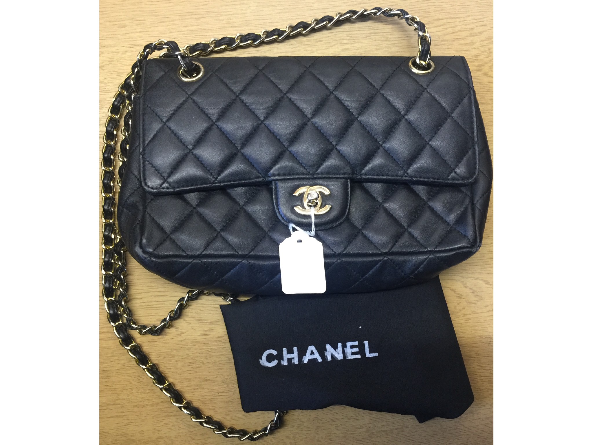 Appraisal: Chanel-style black quilted purse