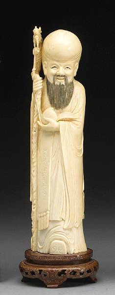 Appraisal: A carved and tinted ivory figure of Shoulao Depicted in