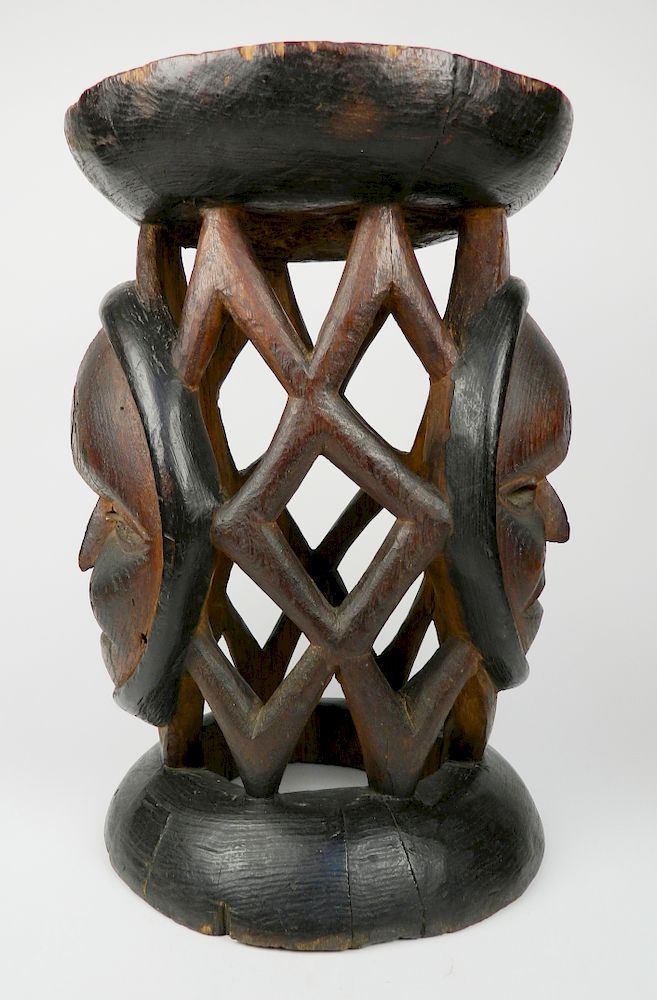 Appraisal: Wooden openwork stool Wooden openwork stool- The mask forms carved