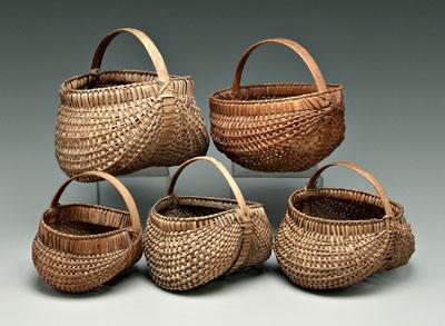 Appraisal: Five oak split egg baskets probably s to s in