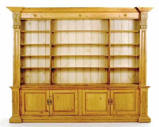 Appraisal: English pine bookcase molded cornice and carved corbels above open