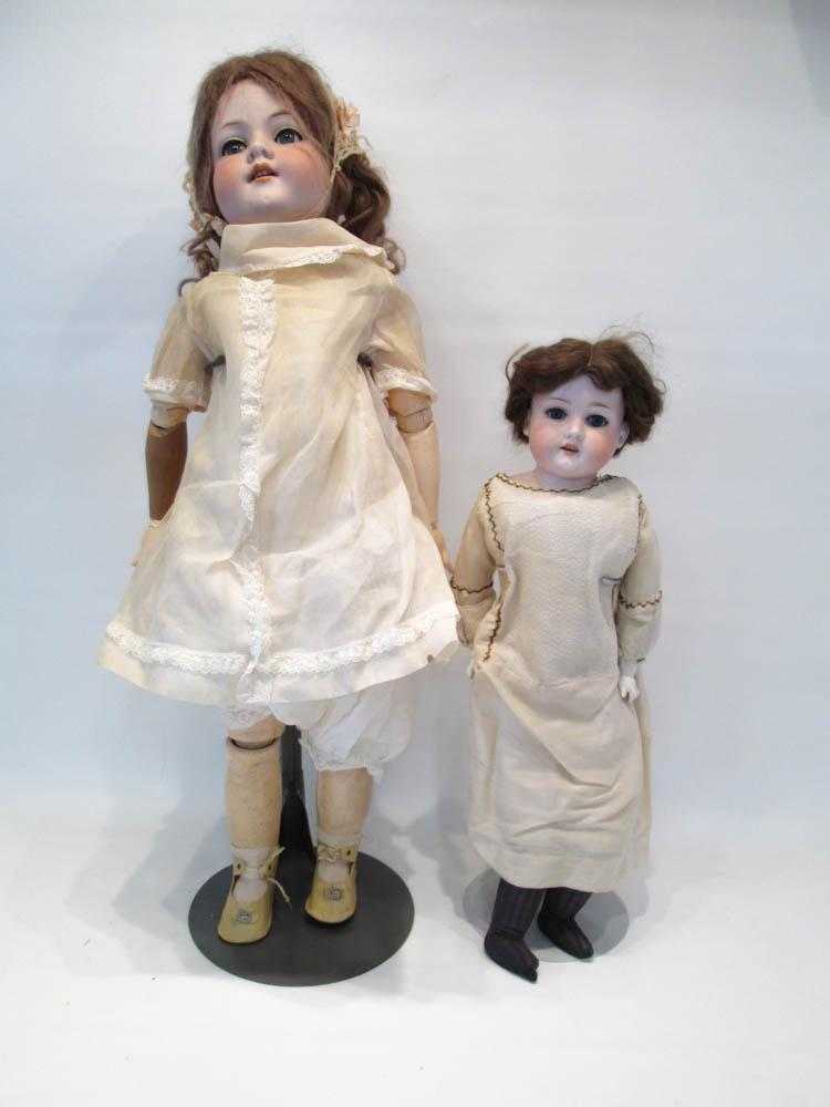 Appraisal: TWO ARMAND MARSEILLE BISQUE HEAD DOLLS Floradora child doll with