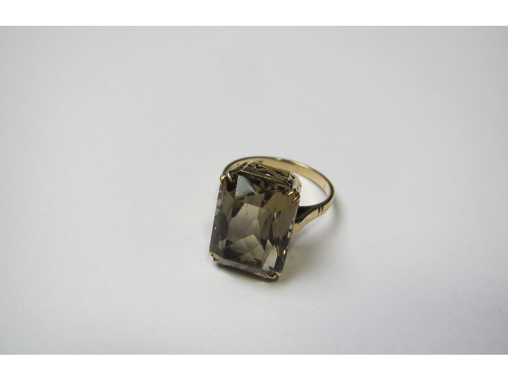 Appraisal: Nine carat gold cushion cut smokey topaz single stone ring