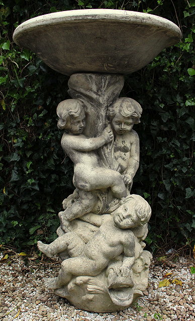 Appraisal: A CAST COMPOSITE STONE BIRD BATH OR GARDEN FOUNTAIN with