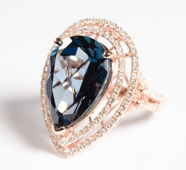 Appraisal: BLUE TOPAZ DIAMOND AND FOURTEEN KARAT ROSE GOLD COCKTAIL RING