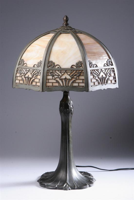 Appraisal: BRONZE AND SLAG GLASS TABLE LAMP early th century Art