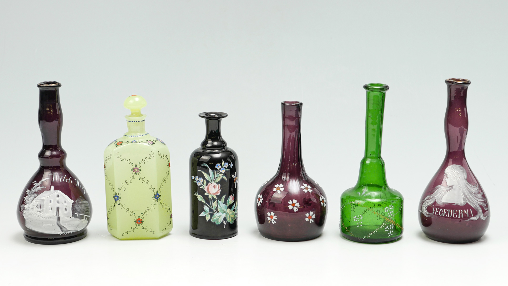 Appraisal: PC ENAMELED GLASS TONIC BARBER BOTTLE COLLECTION Enameled floral figural