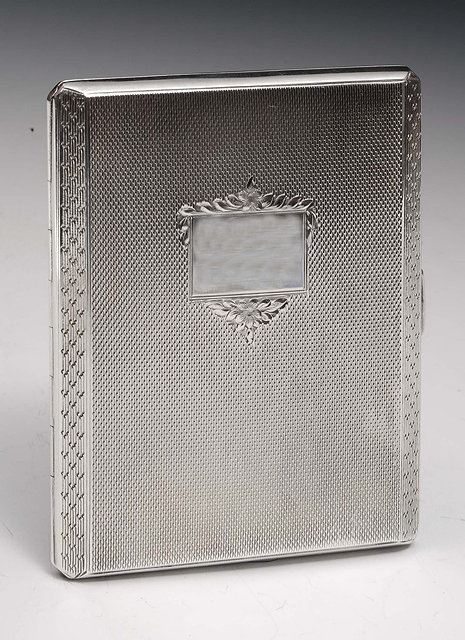 Appraisal: A silver cigarette casewith engine turned decoration and gilt interior