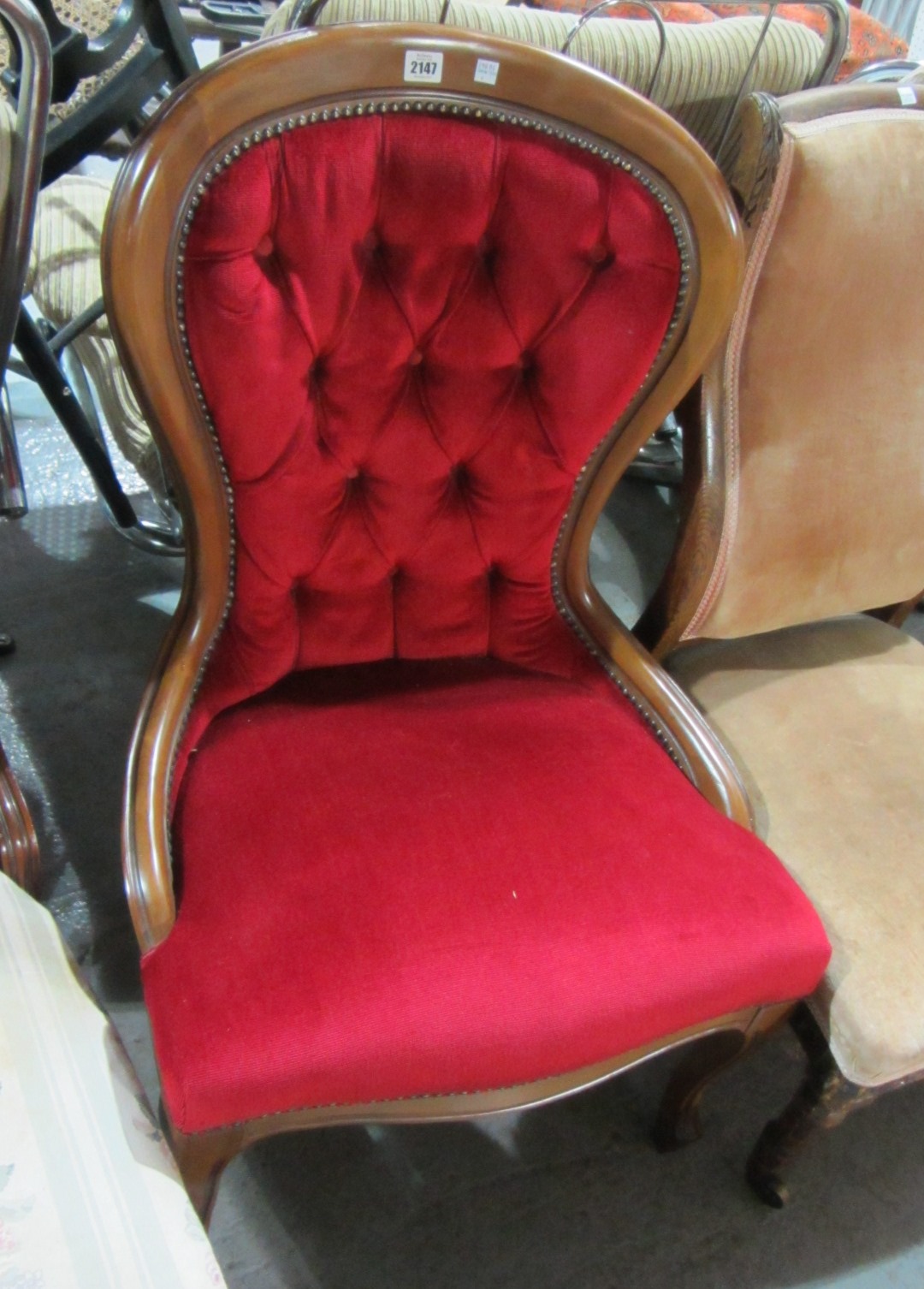 Appraisal: A mahogany button back chair and a small nursing chair