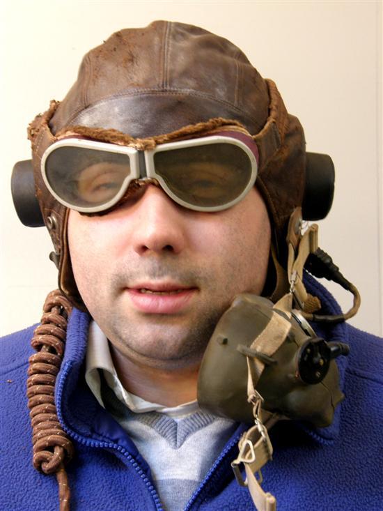 Appraisal: World War leather flying helmet with intercom and adapter mouth