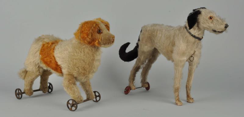 Appraisal: Lot Of Stuffed Dogs On Wheels Moderate hair loss to