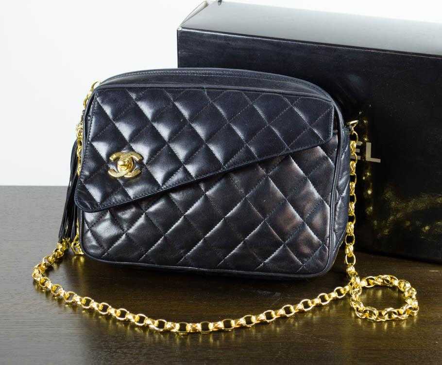 Appraisal: CHANEL QUILTED LEATHER HANDBAG with asymmetrical front pocket having gold