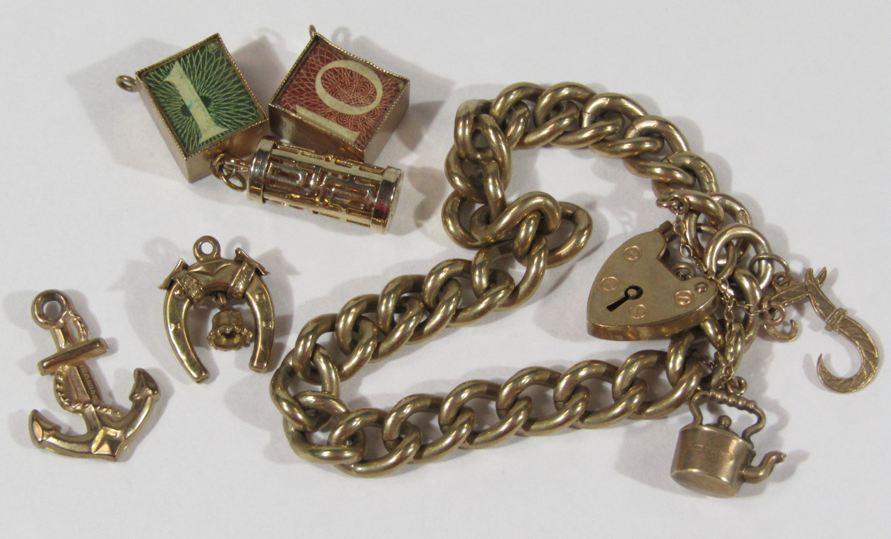 Appraisal: A ct gold curb link charm bracelet attached and loose