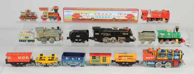 Appraisal: Lot of Tin Litho Train Toys Description Japanese Battery-operated and