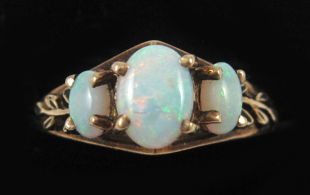 Appraisal: OPAL AND TEN KARAT YELLOW GOLD RING set with three