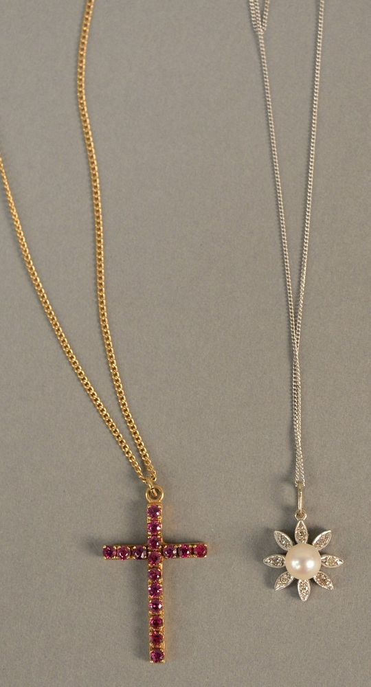 Appraisal: Two pendants and chains to include K gold cross and