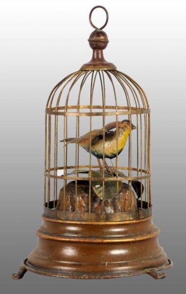 Appraisal: Tin Hand-Painted Birdcage Wind-Up Toy Description German Working When wound