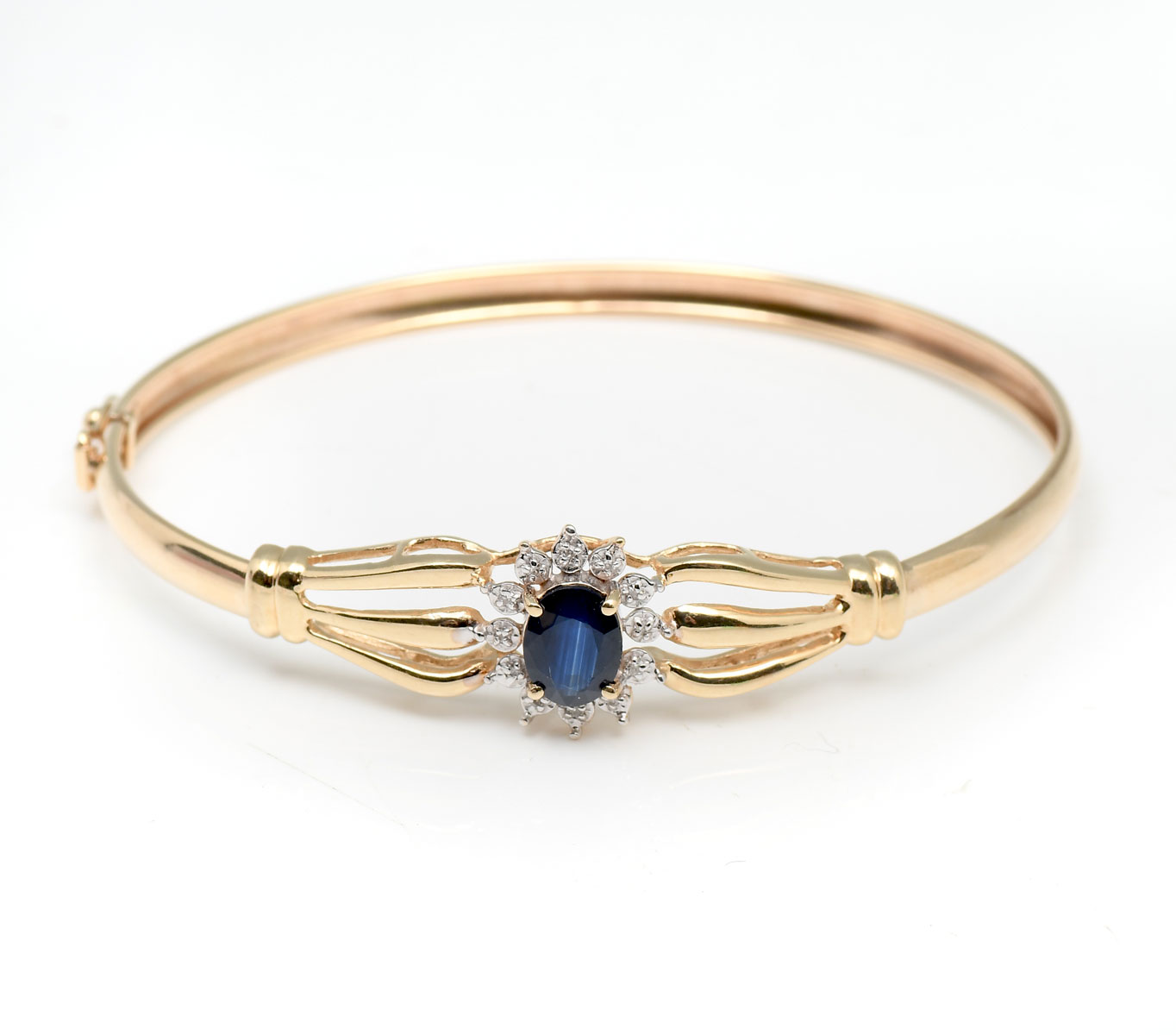 Appraisal: K SAPPHIRE DIAMOND BRACELET K yellow gold bangle bracelet contains