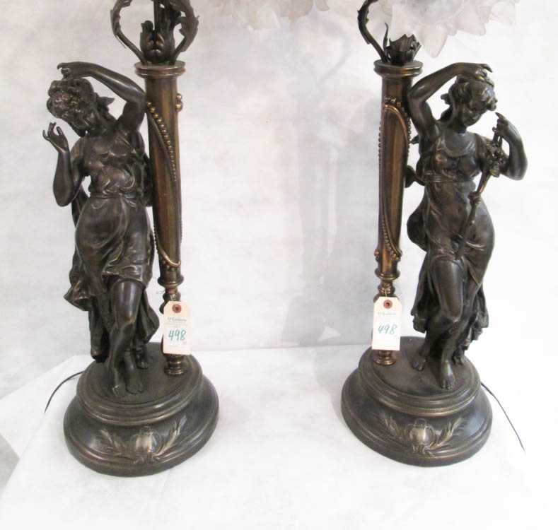 Appraisal: A PAIR OF FIGURAL BRONZED METAL TABLE LAMPS each featuring