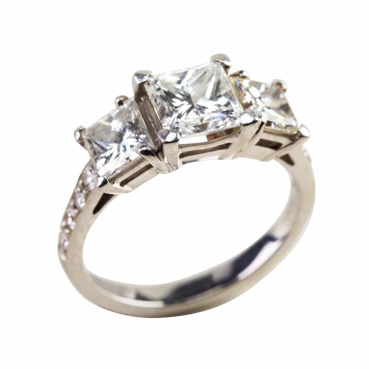 Appraisal: Platinum Ring set with a princess cut diamond ct flanked