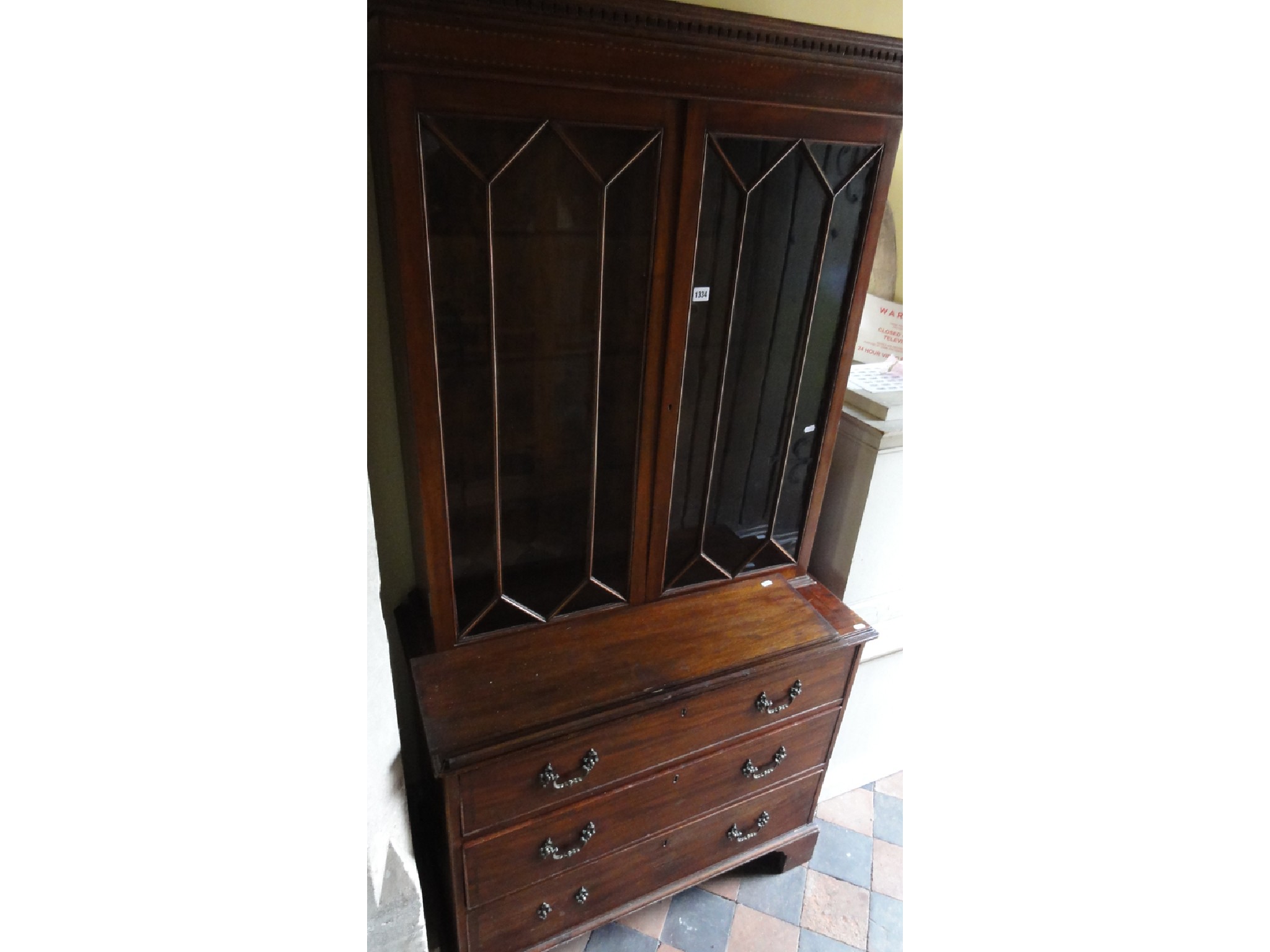 Appraisal: A Georgian mahogany chest of three long graduated drawers with