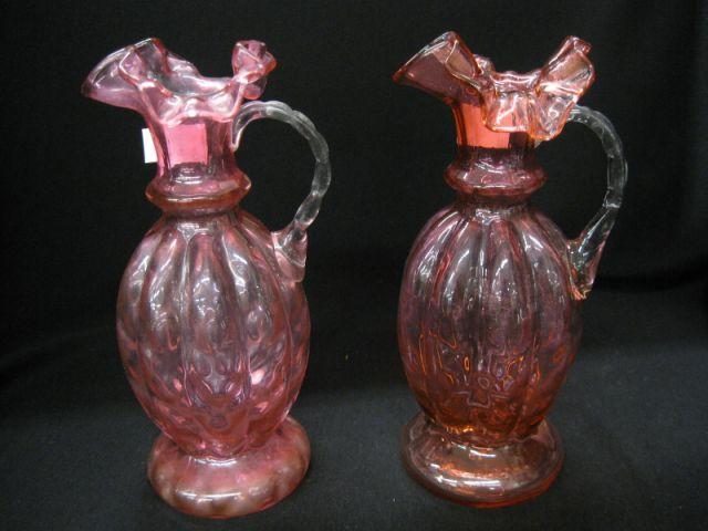 Appraisal: Pair of Cranberry Art Glass Ewers melon ribbed excellent