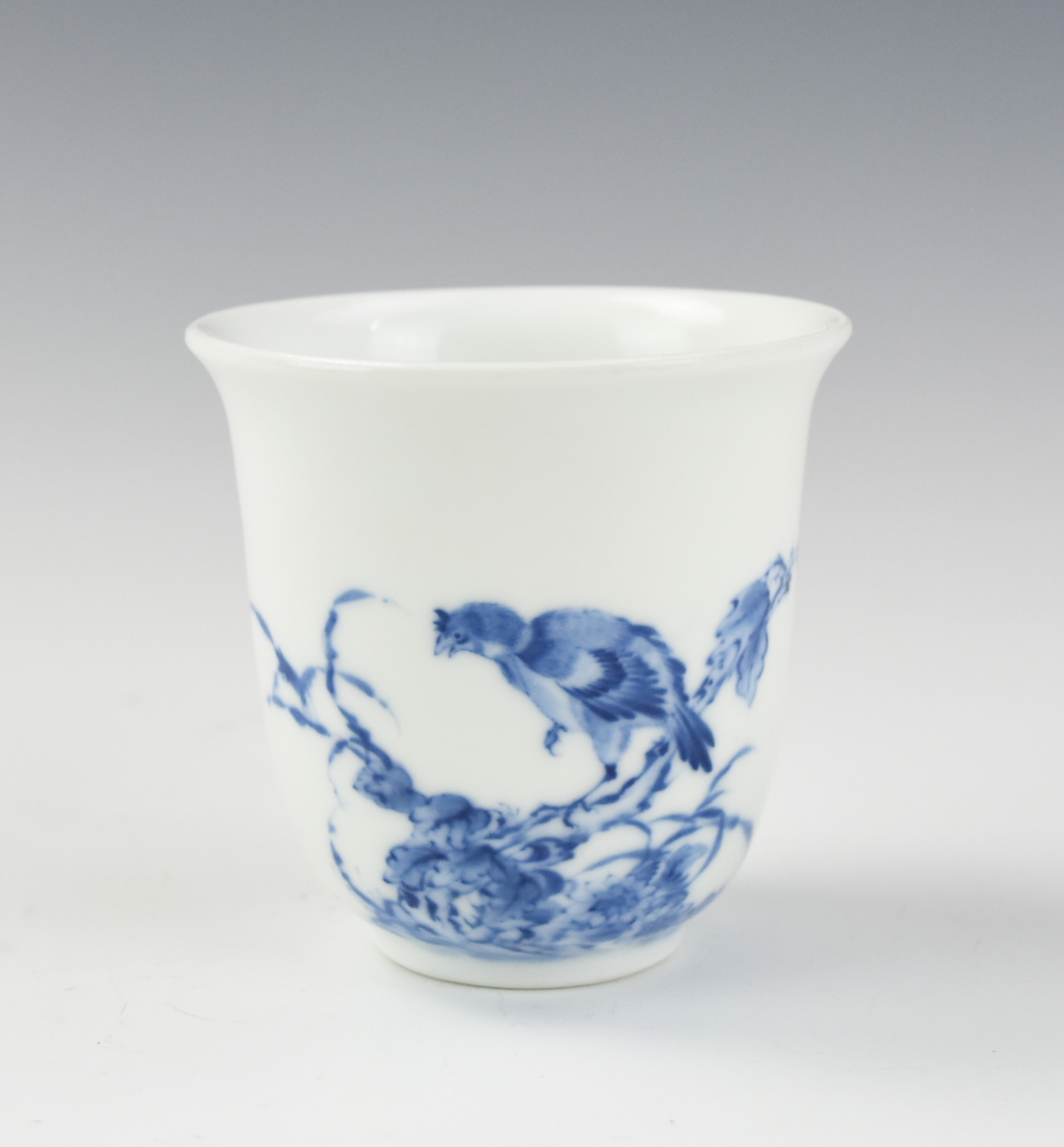 Appraisal: CHINESE BLUE WHITE CUP W BIRD Chinese th C delicately