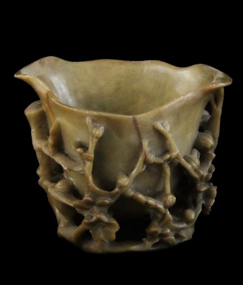 Appraisal: A Chinese soapstone libation cup carved with cherry blossom cm