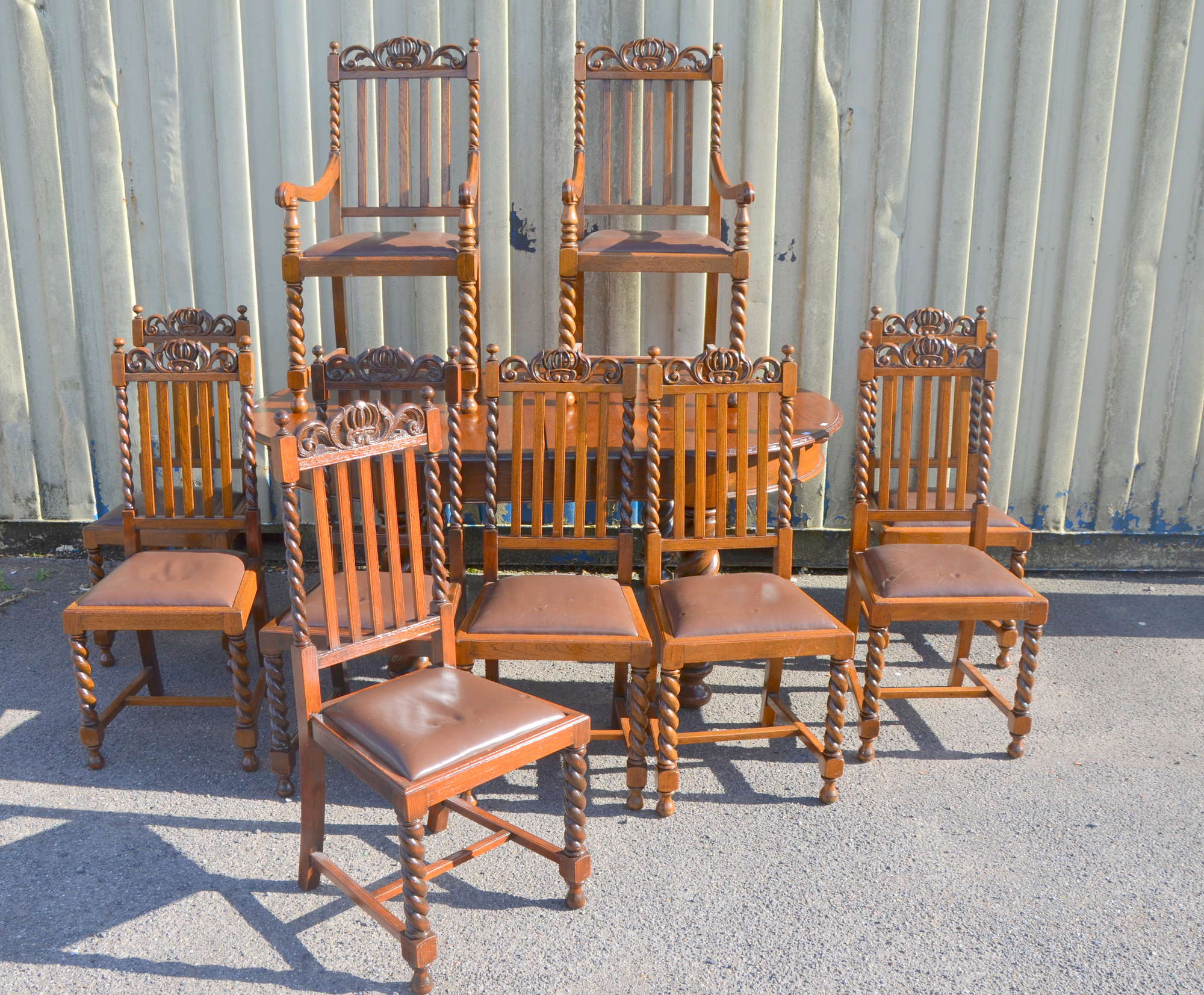 Appraisal: Oak Dining Table and Ten matching chairs with carved top