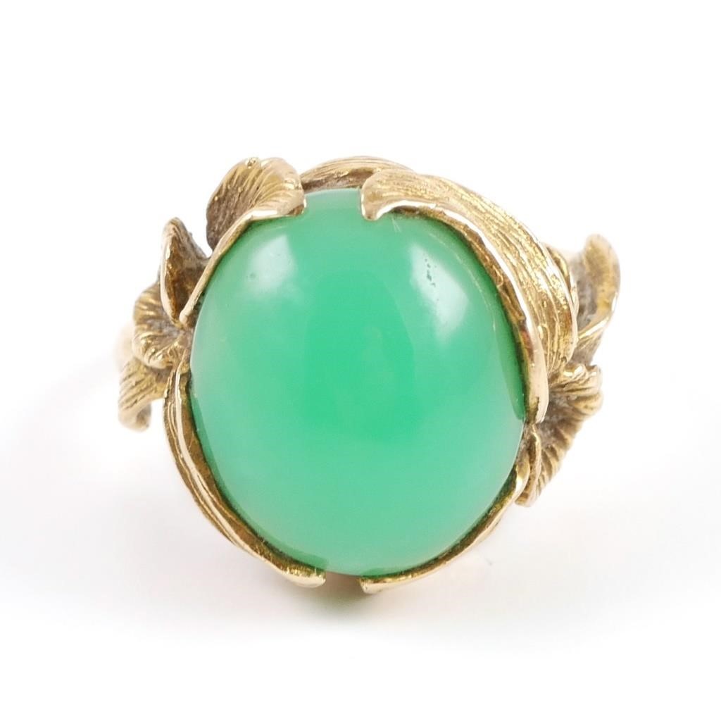 Appraisal: K yellow gold ring contains one oval green chrysoprase cabochon