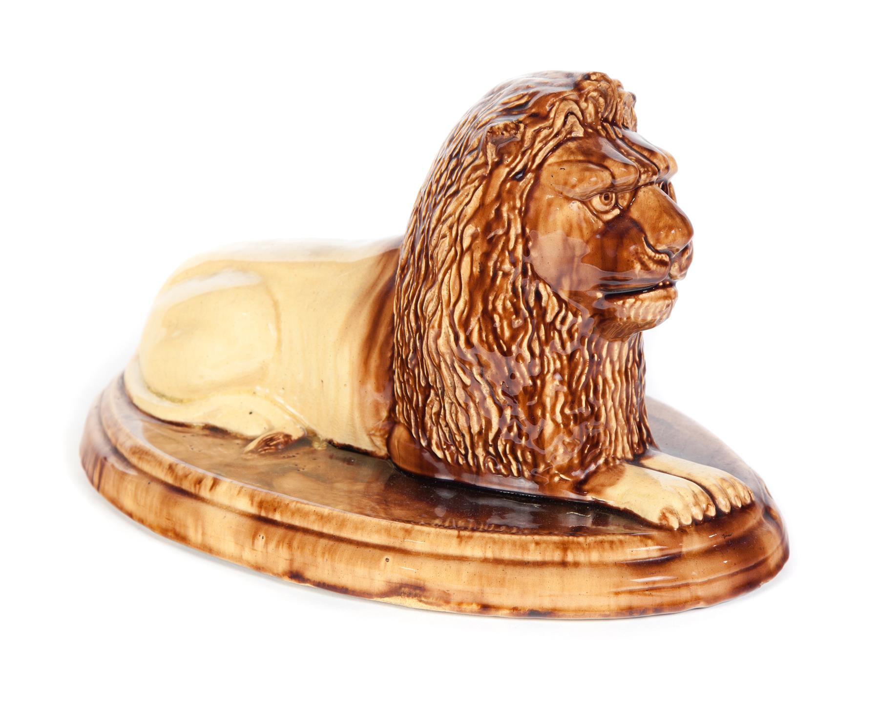 Appraisal: OHIO YELLOWWARE LION Mogadore late th century Reclining lion with