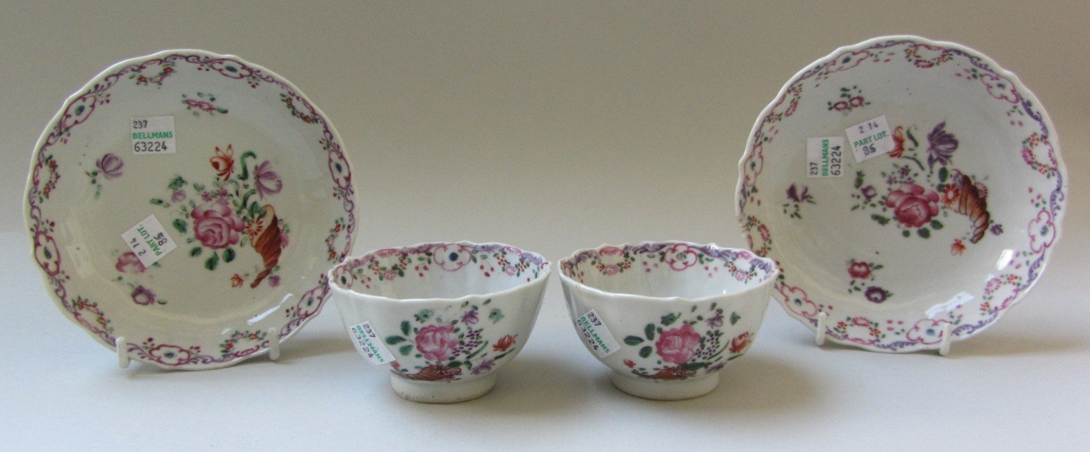 Appraisal: A pair of Chinese famille rose tea bowls and saucers