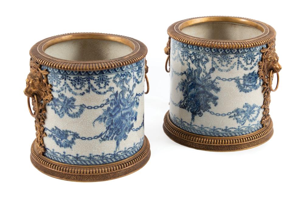 Appraisal: Pair of United Wilson Blue and White Porcelain Bronze-Mounted Cachepots