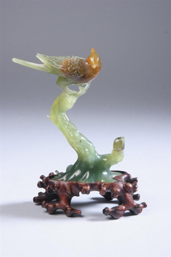 Appraisal: CHINESE JADE FIGURE OF BIRD AND TREE BRANCH th century