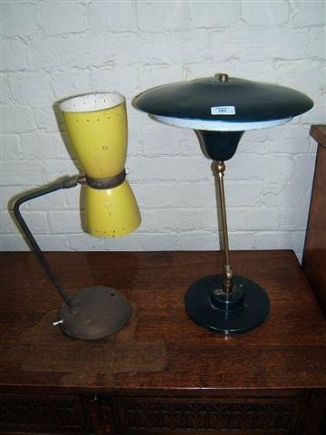 Appraisal: A blue painted spun aluminium table lamp and a further