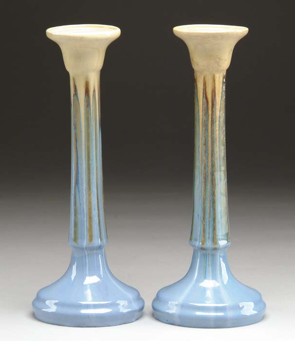 Appraisal: PAIR OF GLAZED POTTERY FULPER CANDLESTICKS WITH FACETED SIDES AND