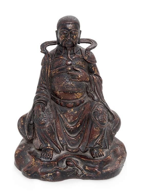 Appraisal: A Gilt Lacquered Bronze Figure of a Daoist Immortal Zhen