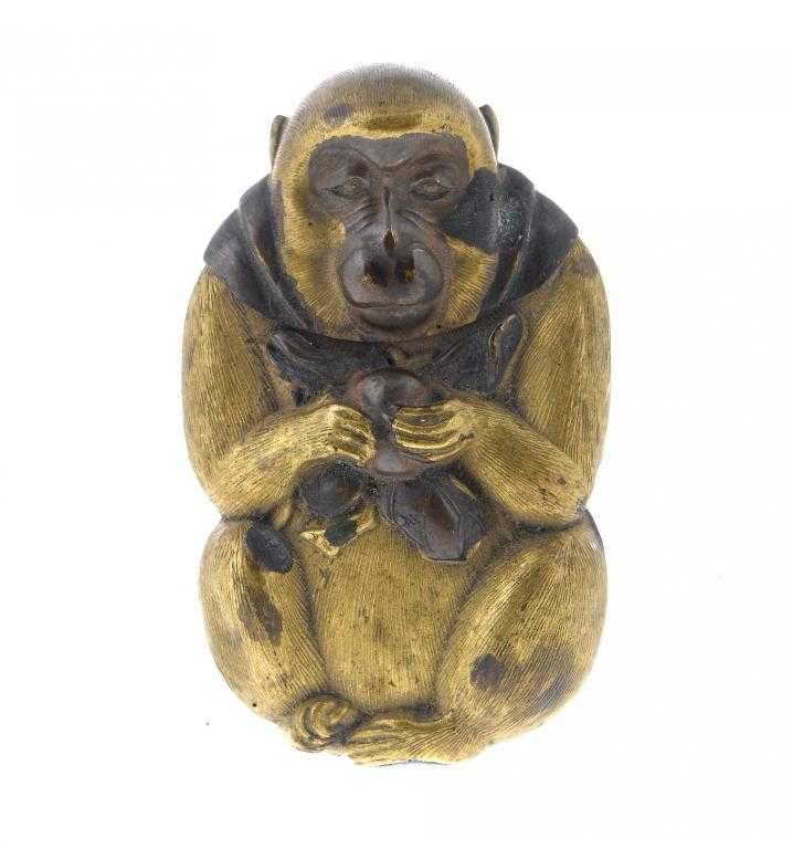 Appraisal: A JAPANESE EMBOSSED AND PATINATED BRASS APE FIGURAL VESTA CASE