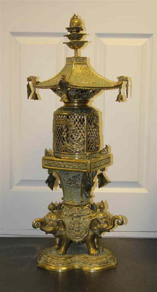 Appraisal: A Chinese bronze three section lantern on elephant supports ft