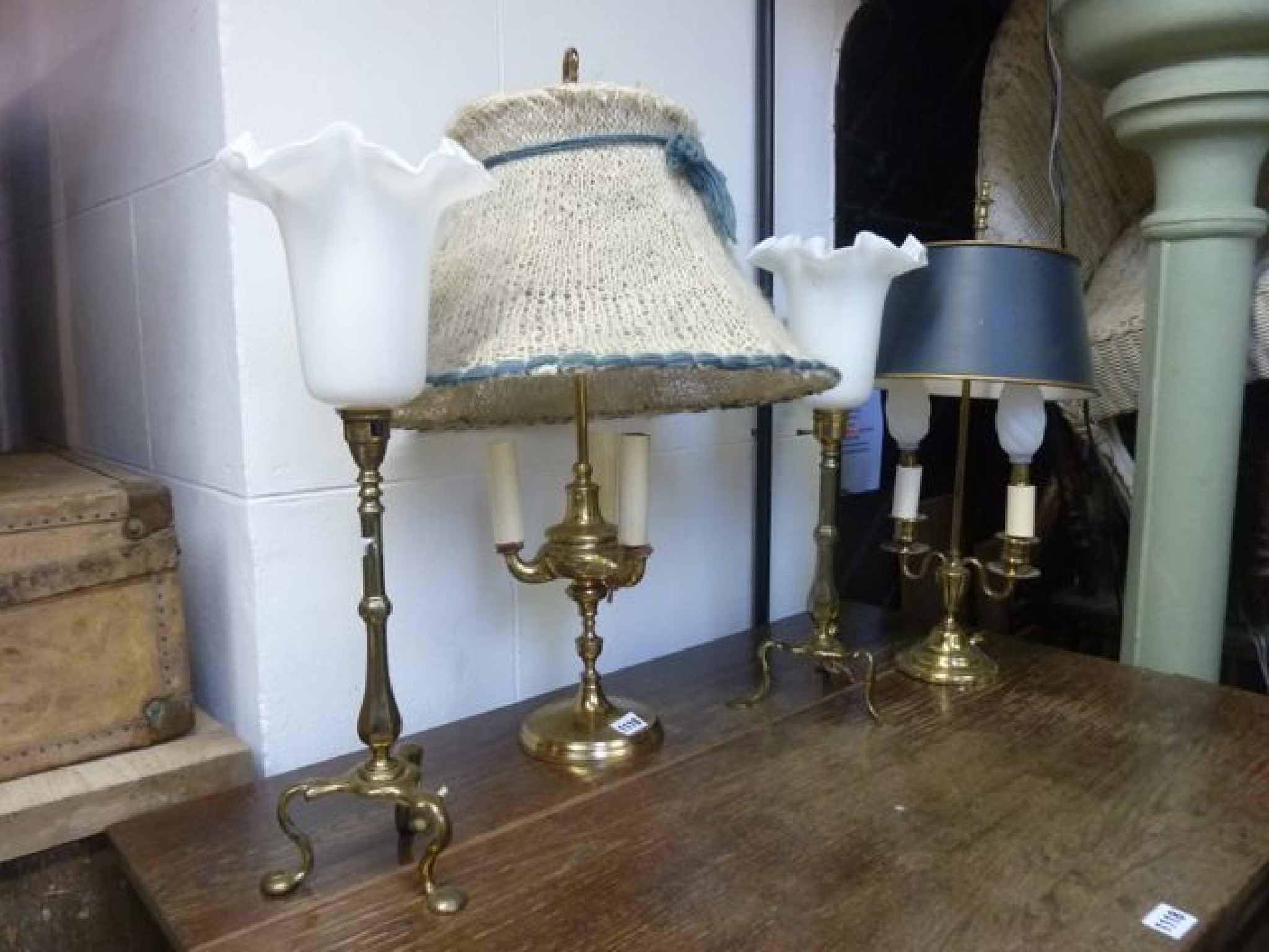 Appraisal: Two Edwardian brass table lamps with tripod bases a further