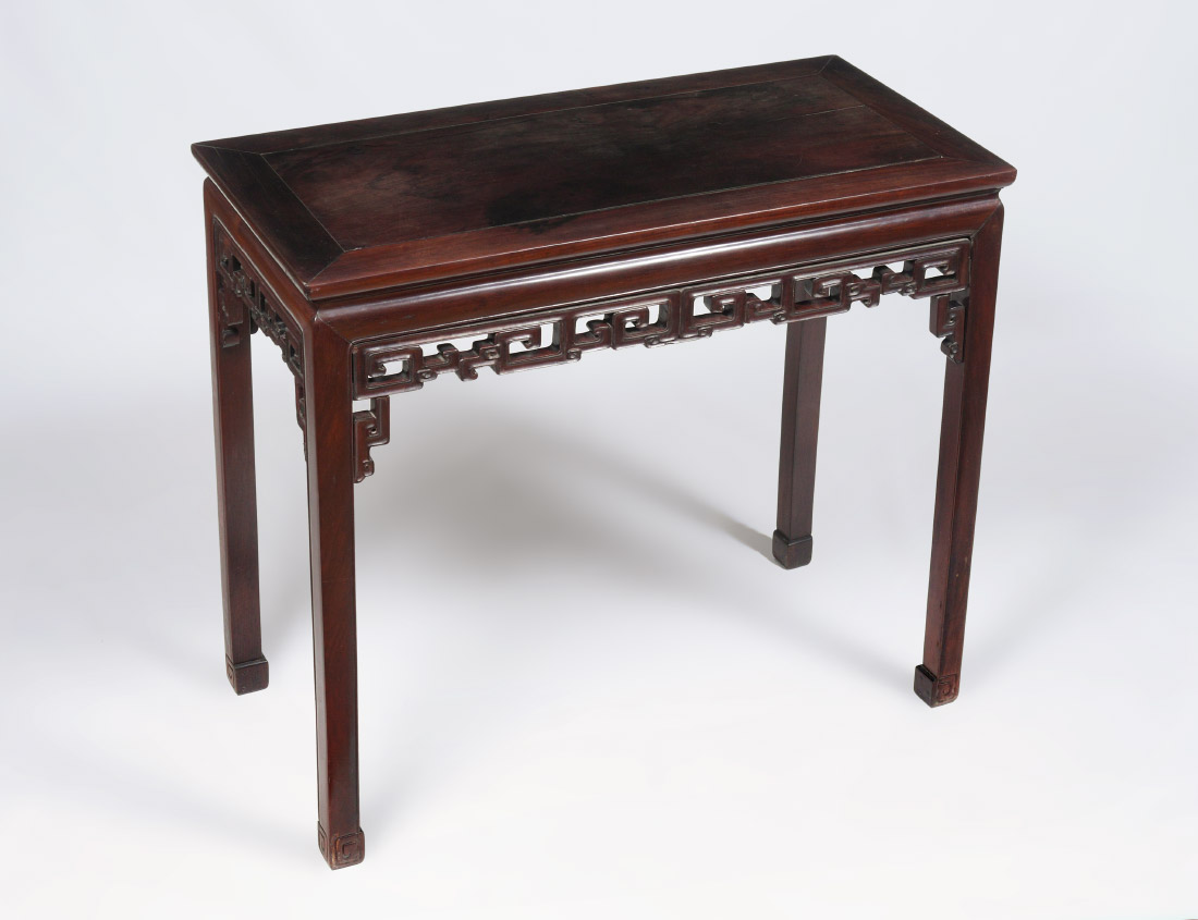 Appraisal: CHINESE CARVED ROSEWOOD ALTAR TABLE Carved open work apron straight